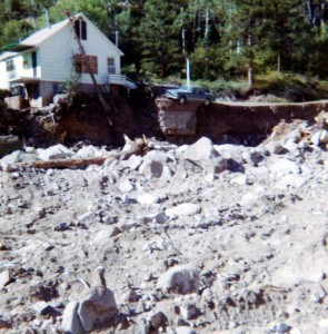 At 15, Sue Brungardt documented the destruction after the Big Thompson Canyon flood in 1976. The photo on the left shows a car precariously on the edge of a small droppoff where the floodwater washed away the riverbank.  Photo courtesy of Sue Brunghart