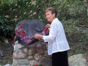 McDonnell  Canyon resident and event coordinator Barb Anderson unveils the newest artwork to remember the victims of the flood.