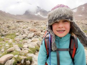Berthoud’s 9-year-old Mollie Davidson smiles for the camera in the boulder field at the base of Longs Peak on Aug. 2. Davidson attempted to hike the 14,000 Longs Peak to raise funds for Second Mile Water. 