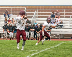 Spartans' quarterback Cody Braesch prepares to pass to wide receiver Micol Woodiel at a preseason scrimmage on Aug. 23. The Spartans begin their season at Valley High School on Friday, Aug. 29.  Karen Fate / The Surveyor