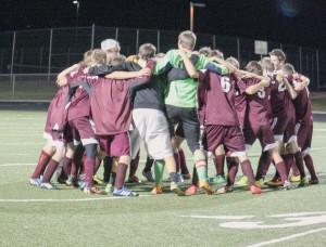 The Berthoud High School boys soccer team comes together after its final game.  Angie Purdy / The Surveyor