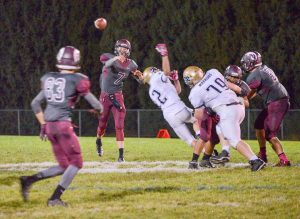 Berthoud quarterback, Cody Braesh, 7, passes for another completion to wide receiver Jackson Hall during the game against Frederick on Oct. 17 at Max Marr Field. Braesh and Hall connected for both Berthoud touchdowns in the game.  John Gardner / The Surveyor