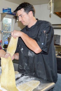 Jason Reiff works skillfully in the kitchen of the Berthoud Inn preparing his Herbed Fettuccini Pasta with Mushroom Medley entree. May Soricelli / The Surveyor
