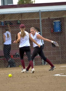 Berthoud softball pitching duo, Taylor Armitage and Larissa Royer celebrate during a recent game at Bein Field at Berthoud High School. The Berthoud Spartans will travel to Colorado Springs to play in the Regional Tournament which begins Oct. 11.  Surveyor file photo