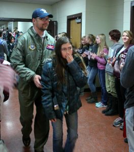 Veteran Aaron Rath walks down the hallway following the flag retirement ceremony. BHS students lined the hallway on both sides from the Commons to the auditorium, amidst waving flags and clapping, the veterans then walked down the hallway to watch the program in the auditorium. Jan Dowker / The Surveyor