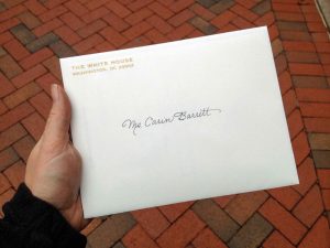 Barrett holds the official invitation to the volunteers' reception at the White House after a few days of decorating. "I was so excited I didn't really want to open it and damage the envelope," Barrett said. 