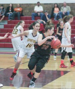 Berthoud’s Sydney Kouns defends Mead’s Haylee McCullough on Jan. 27 at Berthoud High School. The Lady Spartans won the contest 58-45. Karen Fate / The Surveyor