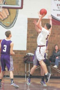 Berthoud’s Noah Purdy takes a shot during the game against Holy Family. Angie Purdy / The Surveyor