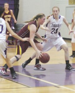 Berthoud's Taylor Armitage pushes for the basket against Holy Family at Berthoud High School on Jan. 23.  Karen Fate / The Surveyor
