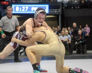 Berthoud's Jimmy Fate wrestles Holy Family's Joseph Prieto in the 145-pound championship match. Fate won the match, securing his second consecutive state title.