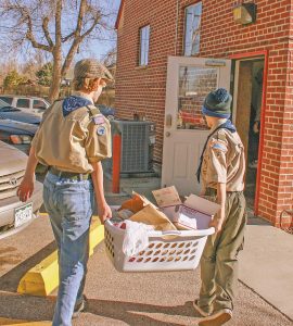Jace Courtright and Richard Schiraldi delivered food to the House of Neighborly Services offi ce in Berthoud. Kayla Dome / The Surveyor
