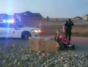 A screenshot of the video shows Larimer County Sheriff's Deputy Kevin Hobson talking to Lilly, 9, Ollie, 6, and Claire Noltimier on April 5. The video, recorded by Mitch Noltimier has had more than 152,000 views.  Courtesy of Lindsay Noltimier / The Surveyor