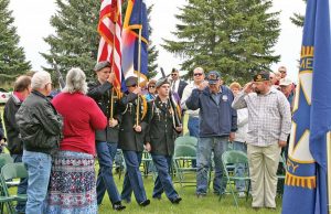 Veterans and residents salute the Thompson Valley High School Color Guard as they present the American and Colorado flags during the Memorial Day ceremony at Greenlawn Cemetery in Berthoud on Monday, May 25. More than 100 people attended the annual event hosted by the American Legion Justin Bauer Memorial Post 67 and the American Legion Auxiliary. Photo by Becky Justice-Hemmann / The Surveyor 