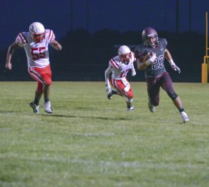Berthoud High School graduate, Michael (Micol) Woodiel competes in a football game at BHS on Sept. 5, 2014.  Surveyor file photo  
