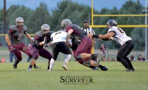 Berthoud's defense including Steele Castles, center, Karsten Bump, and Jamie Gray stop Valley running back Juan Gomez, as free safety Max Bump assists during the first half of the Sept. 4 game at Max Marr Field.  John Gardner / The Surveyor 