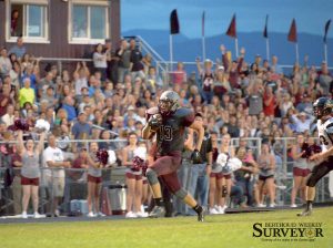 Berthoud tight end Mccallan Castles runs unopposed for a 55-yard touchdown in the first quarter of the Spartans’ season opener at Max Marr Field at Berthoud High School on Sept. 4. Castles, a sophomore, ended the night with three receptions for 85 yards and a touchdown. John Gardner / The Surveyor