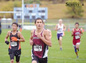 Berthoud’s Elijah Grewal keep a steady pace at the 4A Region 4 Cross Country Championships in Lyons on Oct. 22. Despite the rainy conditions, Grewal said it was perfect conditions for a race. The BHS senior finished in 17 minutes, 12 seconds, good enough for 10th place and a ticket to the 4A State Cross Country Championships in Colorado Springs Saturday. John Gardner / The Surveyor