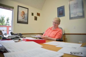 Berthoud Town Clerk Mary Cowdin goes through some of the applications from people who applied to fill her position after she retires at the end of the year. Cowdin has been town clerk for 22 years, and has worked for the Town of Berthoud for 32. John Gardner / The Surveyor