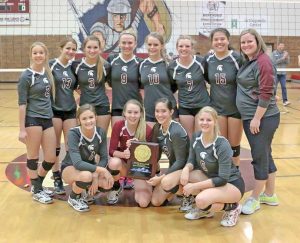 The Berthoud Volleyball team poses for a photo after winning the Class 4A Region 11 tournament and punching their ticket to the state tournament in Denver, starting Nov. 13 at the Denver Coliseum.  Paula Megenhardt / The Surveyor
