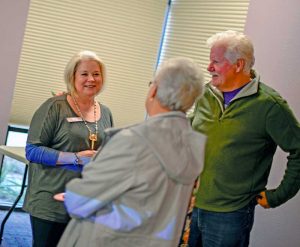 Berthoud Community Library Director Sara Wright speaks with friends at a farewell party at the library on Dec. 8. Many people stopped by to say farewell to the longtime director. John Gardner / The Surveyor