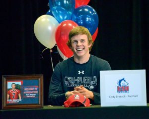 Berthoud High School senior and quarterback Cody Braesch is all smiles right before signing his letter of intent to play football at Colorado State University — Pueblo. Braesch along with four teammates signed letters to play in college next fall. It was the most athletes the school has had sign for football in school history. John Gardner / The Surveyor
