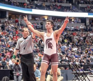 Chad Ellis celebrates his hard-fought victory in the 195-pound Class 3A wrestling championship at Pepsi Center in Denver on Feb. 20.  Karen Fate / The Surveyor