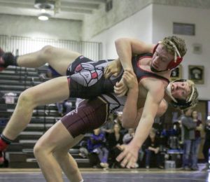 Berthoud’s Wyatt Larson takes down his opponent at the Viking Invitational at Valley High School in Gilcrest on Jan. 30. The Spartans finished in third place as a team in the contest behind Greeley Central and Valley. Karen Fate / The Surveyor