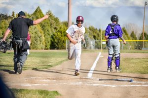 Berthoud's Chris DeSousa crosses home plate during the second inning of Tuesday's game versus Holy Family. The Spartans won the contest 10-5 to give them their second win of the season.  John Gardner / The Surveyor