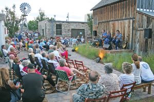 Patrons enjoy music in the courtyard at the Little Thompson Valley Pioneer Museum at one of the summer concert series. The series has three shows left this year. Photo courtesy of the Berthoud Historical Society
