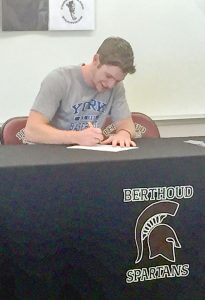 Berthoud High School graduate Patrick Barron signs his letter of intent, to play baseball at York College in Nebraska, at Berthoud High School last week. Courtesy photo