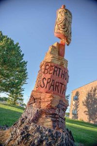 A blue spruce on the Berthoud High School campus that recently died was sculpted into this piece, including a Spartans shield and sword, by Loveland artist Faye Braaten. The sculpture stands on the west side of the building and is a monument to Spartans past, present and future. Surveyor photo
