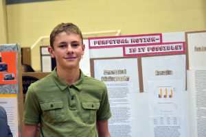 Perpetual motion intrigued TMS student Max Horvath. His experiment earned a second-place award. Bob McDonnell / The Surveyor