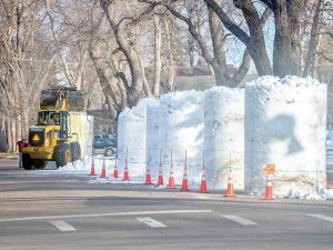 Volunteers work to construct the large snow blocks that will be used in the Snow Sculpting Competition Thursday through Saturday. The event is the anchor to the inaugural Berthoud Snowfest that also includes the annual Parade of Lights Saturday night along Mountain Avenue. Berthoud Weekly Surveyor photo